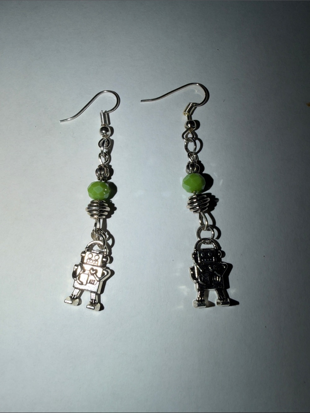 Silver Robot Dangle Earrings with Green Beads by Sassy Charmer